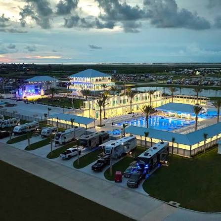 RV resort and pool illuminated in the evening